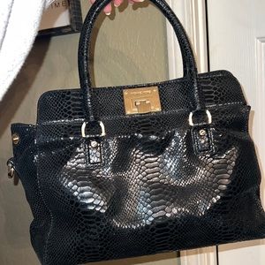 Black Michael Kors purse, snakeskin look! Sides unbutton so purse can expense